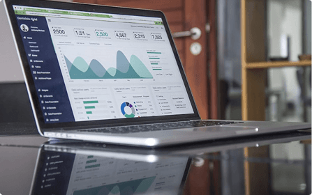 Laptop displaying benchmark performance dashboard